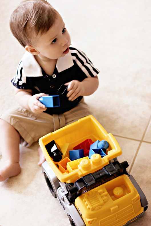 baby-boy-playing-with-dump-
