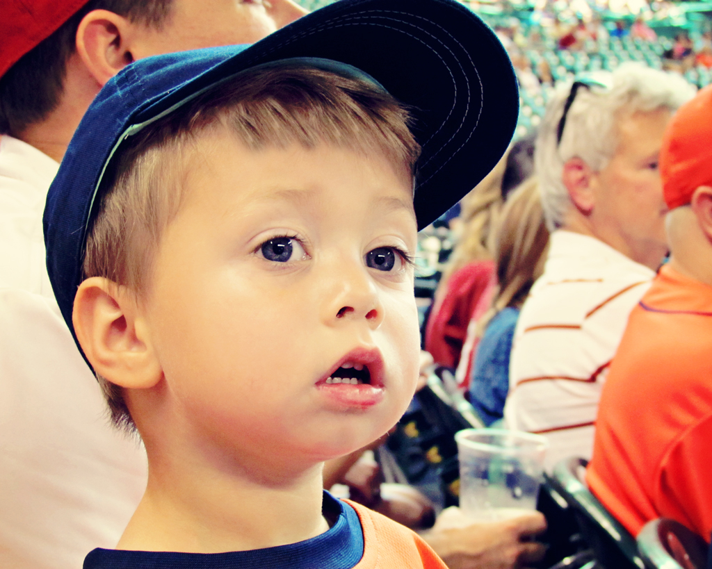 toddler-looking-on-at-astros-baseball-game