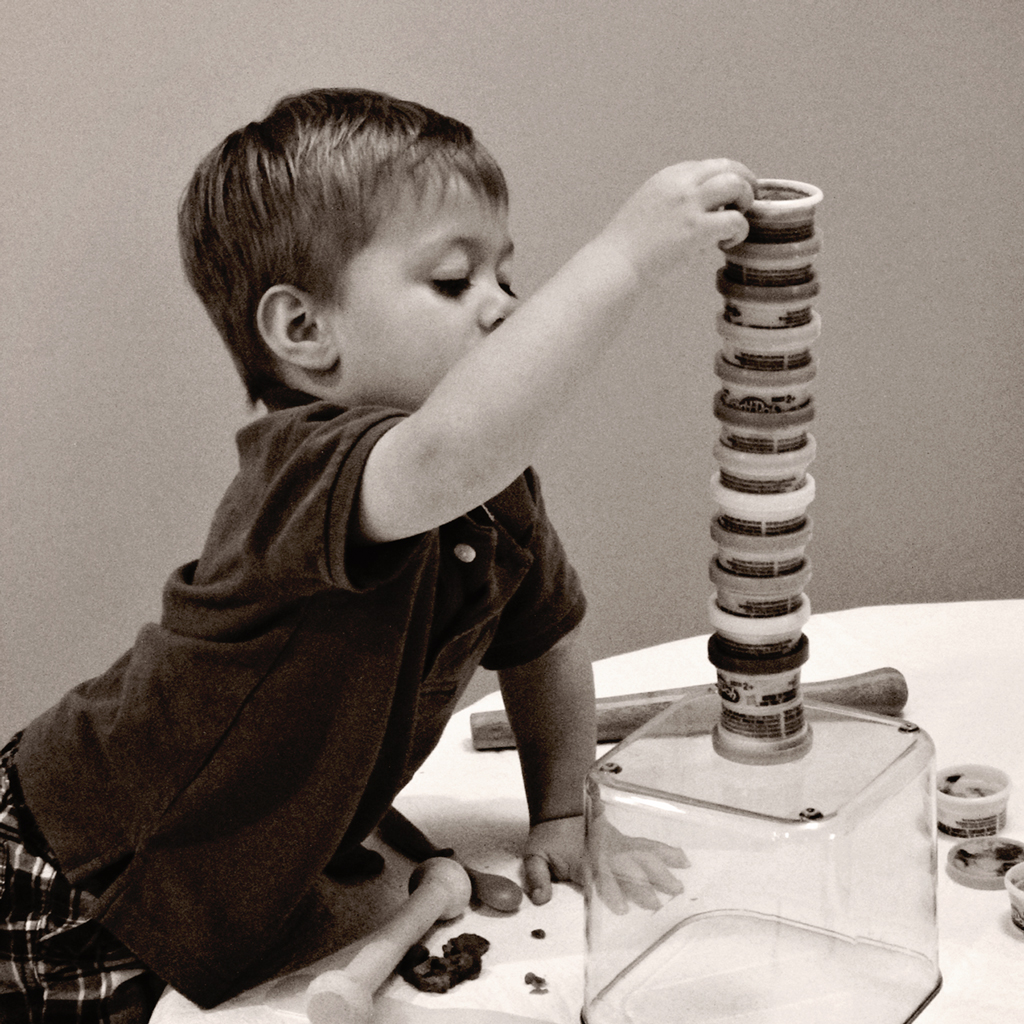 toddler-playing-play-doh-building-tower