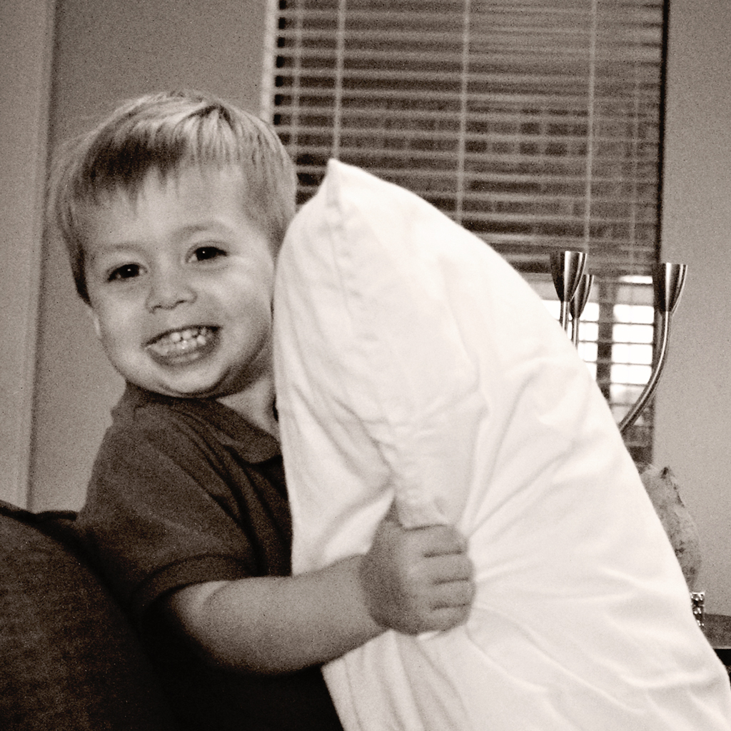 toddler-standing-on-couch-being-naughty
